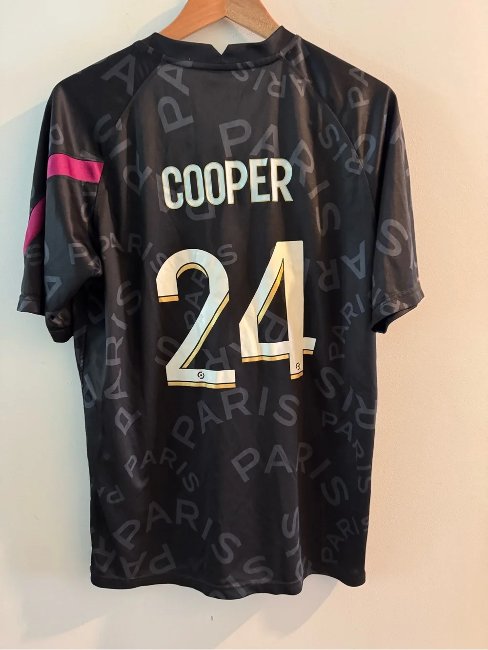 Jordan Men’s Black Jersey with Gold Logos and Pink Sleeve Detail